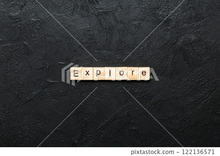 Explore word written on wood block. Explore text on cement table for your desing, concept 122136571