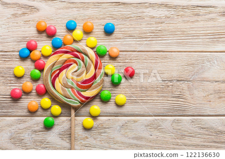 Tasty appetizing Party Accessories Happy Birthday Sweet. Different types of candies on colored background, copy space. Colorful birthday party background 122136630