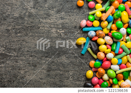 Mixed collection of colorful candy, on colored background. Flat lay, top view. frame of colorful chocolate coated candy Mixed collection of colorful candy, on colored background. Flat lay, top view. frame of colorful chocolate coated candy 122136636