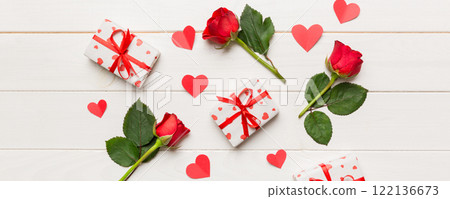 Kraft Gift box with beautiful red ribbon and rose, concept of Valentine day, anniversary, mother day and birthday greeting, copy space, top view 122136673