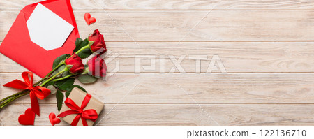 Valentine day composition with Envelope, rose flower and Red heart on table. Top view, flat lay. Holiday concept Valentine day composition with Envelope, rose flower and Red heart on table. Top view, flat lay. Holiday concept 122136710