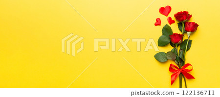 Valentine day composition with rose flower and red heart on table. Top view, flat lay, copy space Holiday concept Valentine day composition with rose flower and red heart on table. Top view, flat lay, copy space Holiday concept 122136711