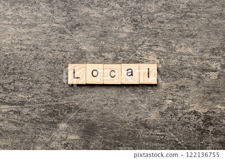 local word written on wood block. local text on table, concept 122136755