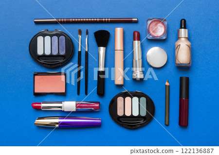 Professional makeup tools. Top view. Flat lay. Beauty, decorative cosmetics. Makeup brushes set and color eyeshadow palette on table background. Minimalistic style Professional makeup tools. Top view. Flat lay. Beauty, decorative cosmetics. Makeup brushes set and color eyeshadow palette on table background. Minimalistic style 122136887