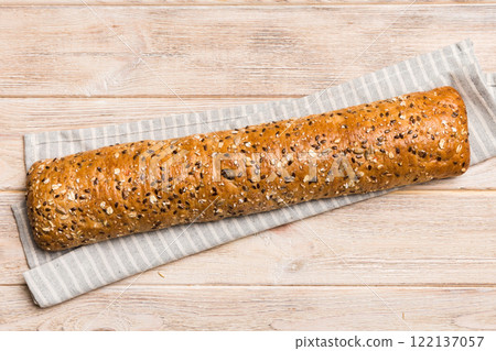 fresh crunchy french baguette on colored table. Top view Bakery products 122137057
