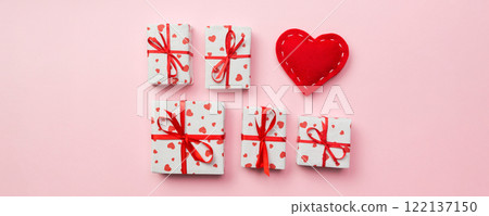 Gift box with red hearts on coral background. top view with copy space 122137150