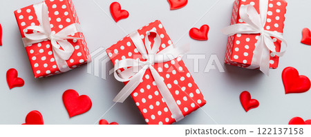 Valentine day composition Background: red gift box with bow and heart. Christmas present. View from above. Holday greeting card 122137158