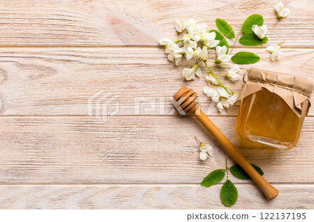 honey jar with acacia flowers and leaves. fresh honey top view flat lay 122137195