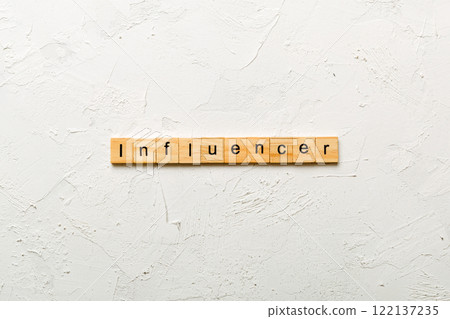 influencer word written on wood block. influencer text on table, concept 122137235