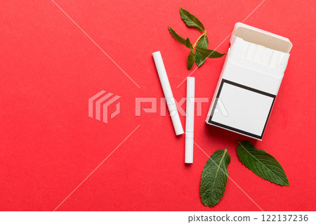 Pack of menthol cigarettes and fresh mint on colored table, Menthol cigarettes top view flat lay 122137236
