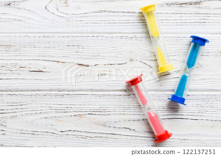 hourglass on the table, sand clock as time passing concept for business deadline, copy space hourglass on the table, sand clock as time passing concept for business deadline, copy space 122137251