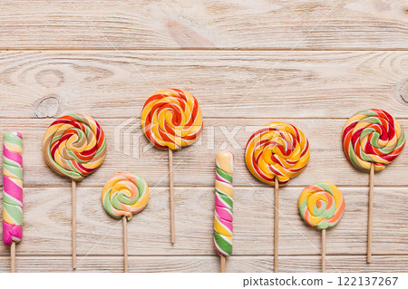 Set of colorful lollipops on colored background. Summer concept. Party Happy Birthday or Minimalist Concept 122137267