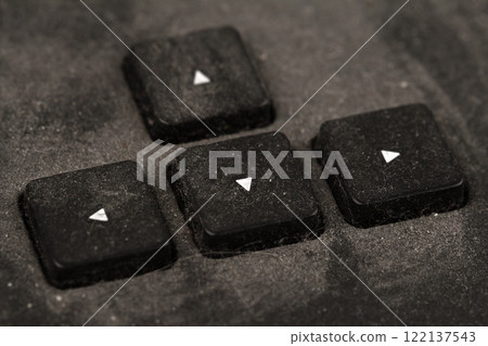 old black keyboard with arrow keys covered in dust and dirt isolated on white background old black keyboard with arrow keys covered in dust and dirt isolated on white background 122137543