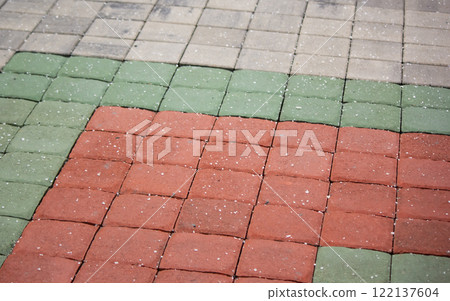 Drawing of burgundy and green paving slabs. Close-up. Top view. Background. 122137604