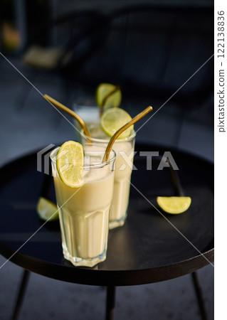 Creamy Lime Cocktail with Condensed Milk in a Refreshing Tropical Style 122138836
