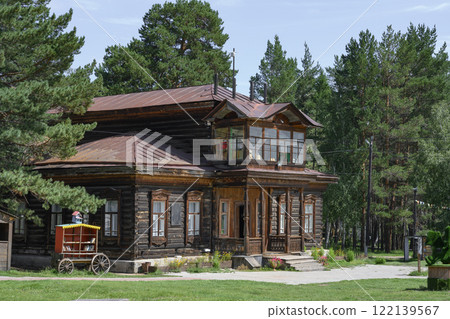 A 19th-century wooden house with carved platbands and bookcrossing cart in Ulan-Ude, Russia A 19th-century wooden house with carved platbands and bookcrossing cart in Ulan-Ude, Russia 122139567