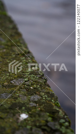 Concrete river fence. The diagonal line. Minimalism Concrete river fence. The diagonal line. Minimalism 122140077