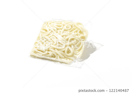 Udon noodles in a bag before boiling, photographed against a white background 122140487