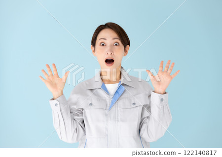 Woman work clothes surprised 122140817