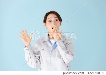 Woman work clothes surprised 122140818
