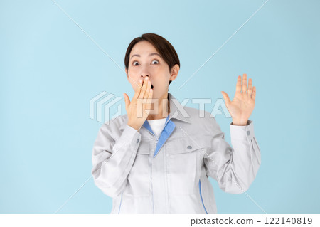 Woman work clothes surprised 122140819