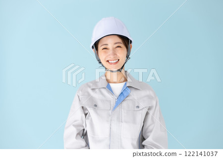 Woman, work clothes, helmet Woman, work clothes, helmet 122141037