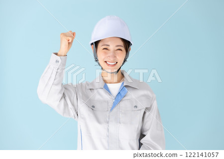 Woman, work clothes, helmet, fist pump 122141057