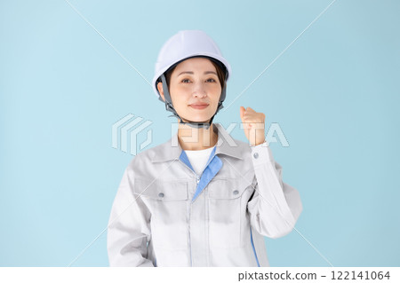 Woman, work clothes, helmet, fist pump Woman, work clothes, helmet, fist pump 122141064