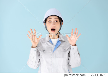 Woman, work clothes, helmet, surprised Woman, work clothes, helmet, surprised 122141073