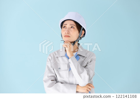 Woman work clothes helmet worries Woman work clothes helmet worries 122141108