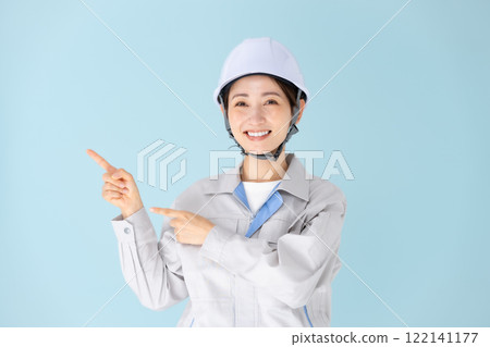 Woman, work clothes, helmet, pointing 122141177