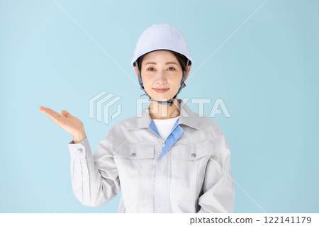 Woman, work clothes, helmet, hand-waving Woman, work clothes, helmet, hand-waving 122141179
