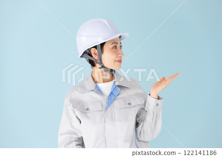 Woman, work clothes, helmet, hand-waving 122141186