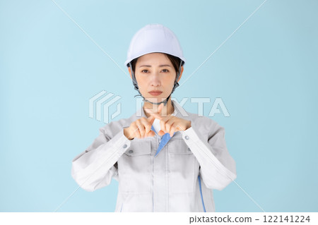 Woman, work clothes, helmet, cross Woman, work clothes, helmet, cross 122141224