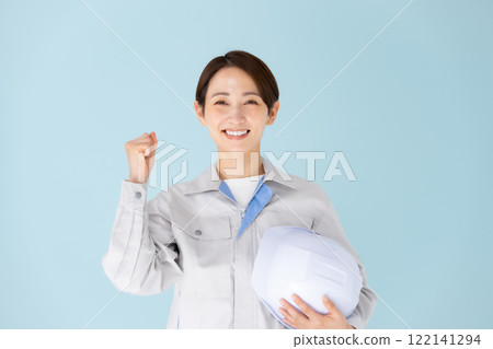Woman, work clothes, helmet, fist pump 122141294
