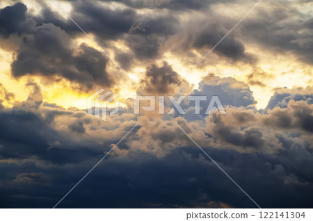orange and blue background with cloudy sky with clouds at sunset in evening 122141304