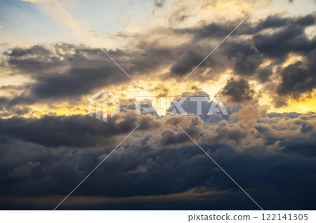 orange and blue background with cloudy sky with clouds at sunset in evening 122141305
