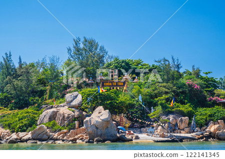 View of the Tu Ton Pagoda Island in Nha Trang. Buddhist temple on an island in the middle of the sea in Asia. 122141345