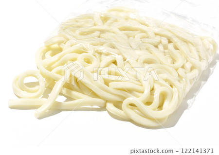 Udon noodles in a bag before boiling, photographed against a white background Udon noodles in a bag before boiling, photographed against a white background 122141371