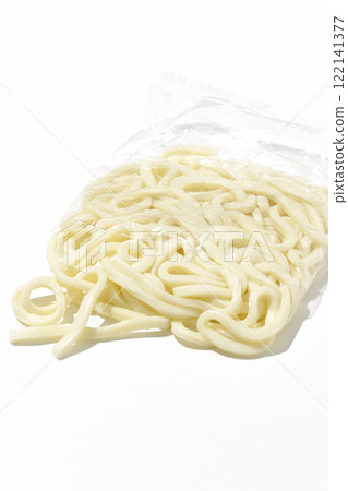 Udon noodles in a bag before boiling, photographed against a white background Udon noodles in a bag before boiling, photographed against a white background 122141377