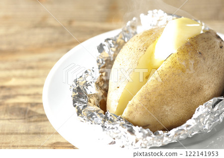 Hot and steaming potatoes with butter Hot and steaming potatoes with butter 122141953