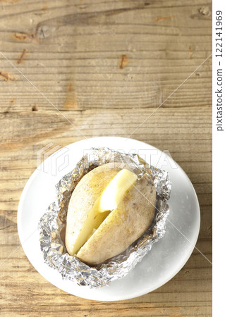 Hot and steaming potatoes with butter 122141969