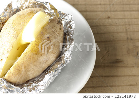 Hot and steaming potatoes with butter Hot and steaming potatoes with butter 122141978