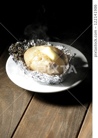Hot and steaming potatoes with butter Hot and steaming potatoes with butter 122141986