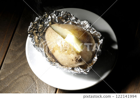 Hot and steaming potatoes with butter Hot and steaming potatoes with butter 122141994