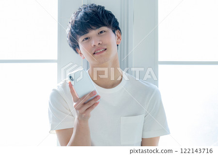 A man with a smartphone 122143716