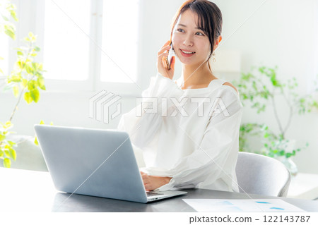 Young woman doing telework in the living room 122143787