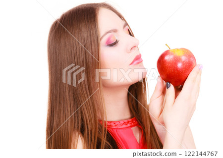 Woman charming girl colorful makeup holds apple fruit 122144767