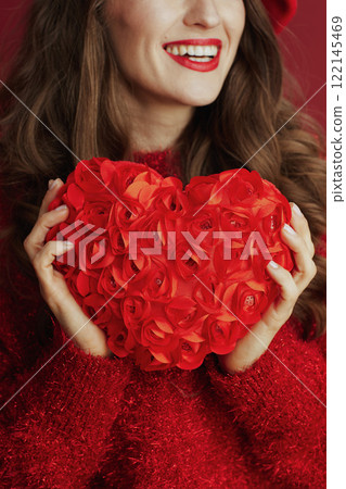 Closeup on woman in red sweater and beret 122145469