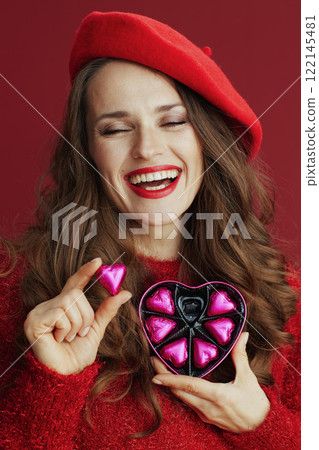 smiling stylish female in red sweater and beret smiling stylish female in red sweater and beret 122145481